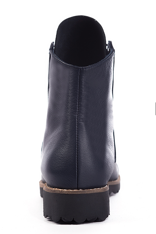 Navy blue women's ankle boots with laces at the front. Round toe. Flat rubber soles. Worn view - Florence KOOIJMAN